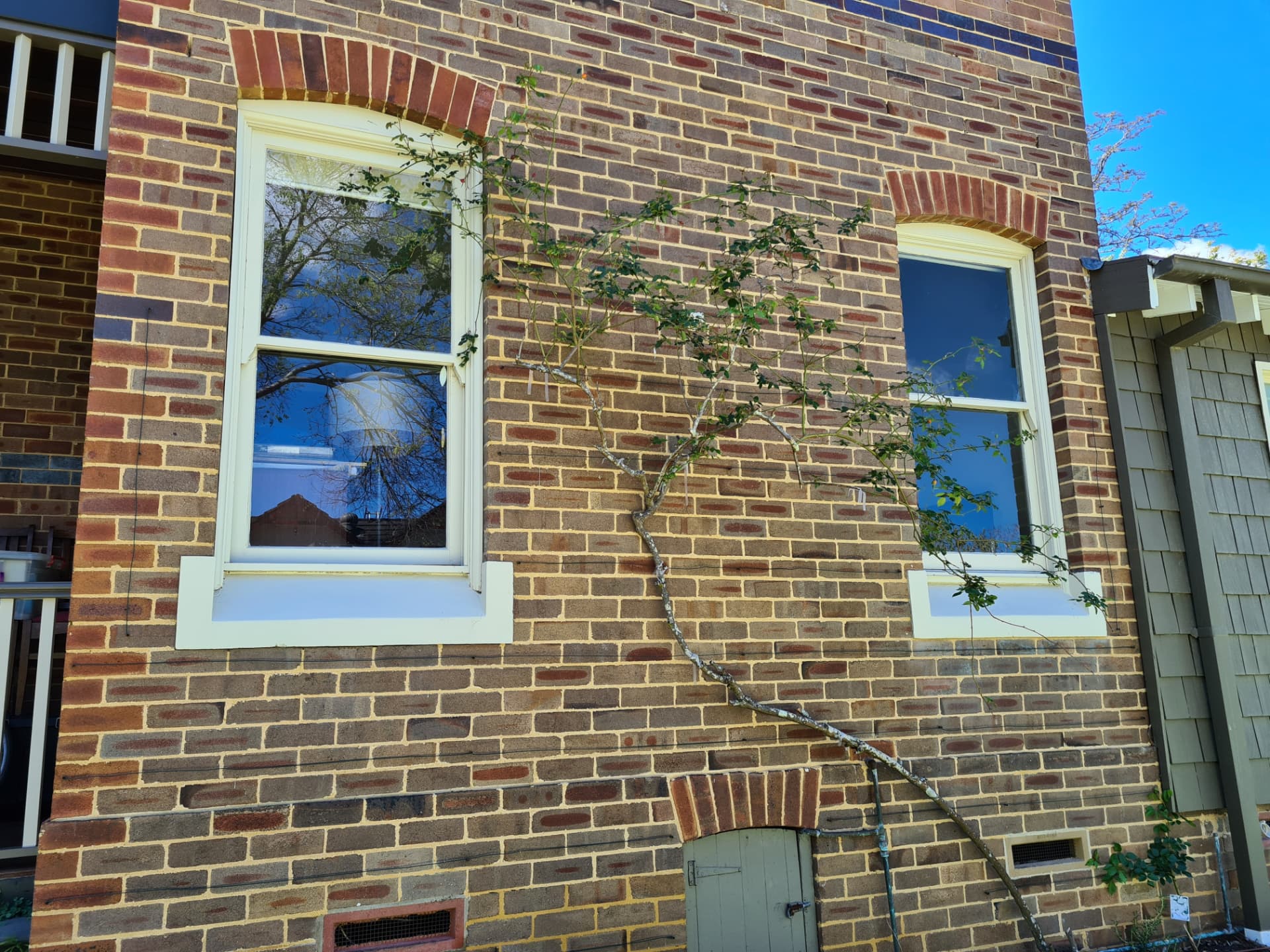 Weathered mortar joints and cracking across an older Sydney brick home