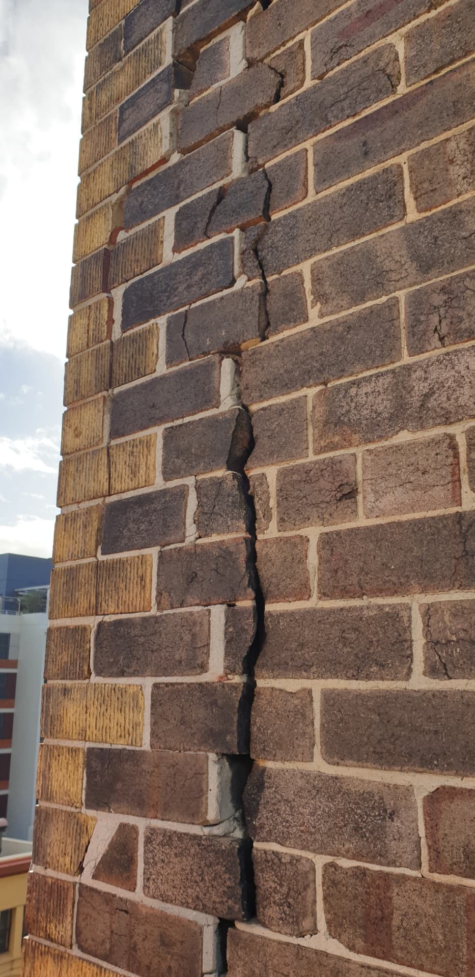 Deteriorated bricks in an existing wall before replacement