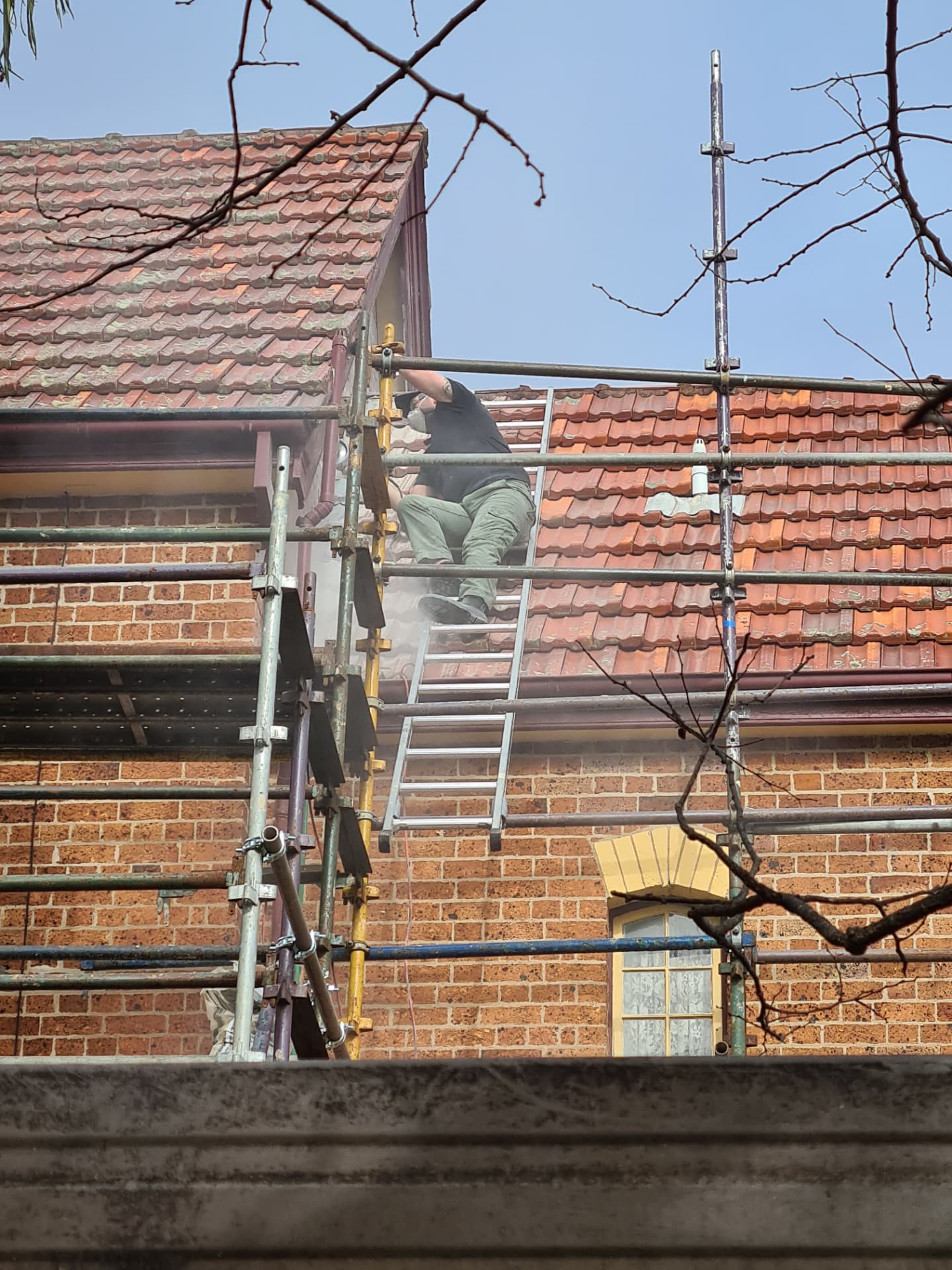 Repointing and brick repairs in progress.